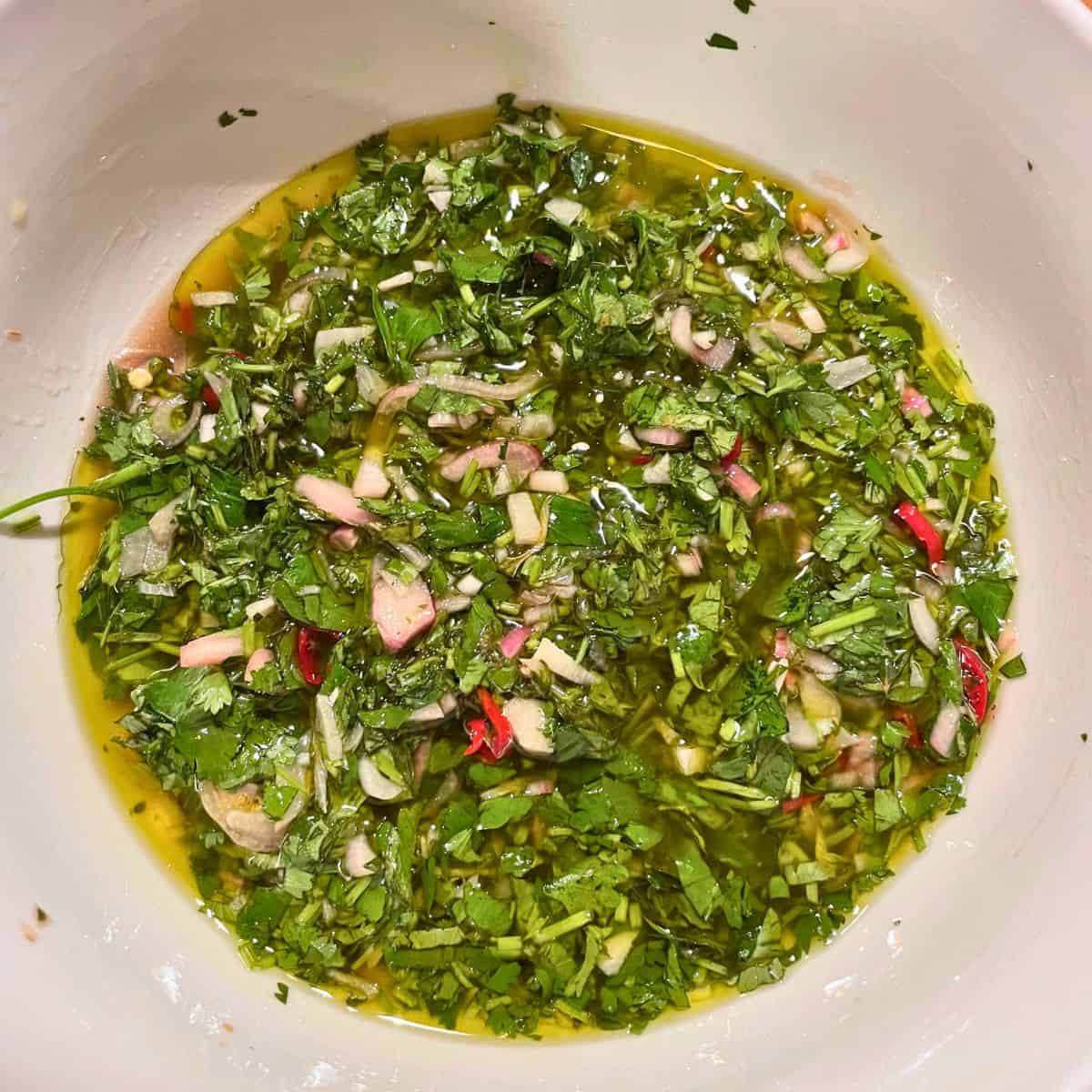 Chimicurri in a white bowl.