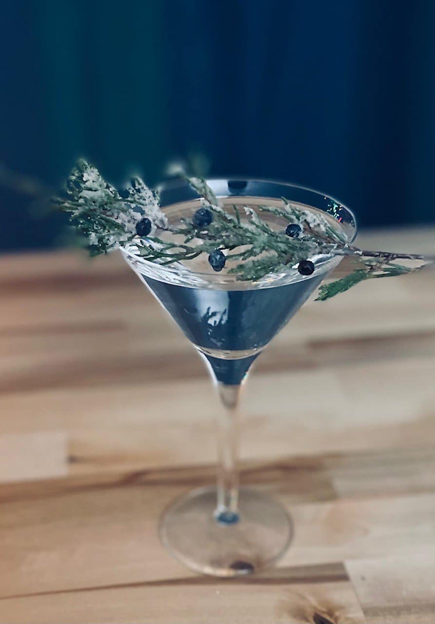 Juniper Martini. Gin Martini garnished with Juniper Sprig.