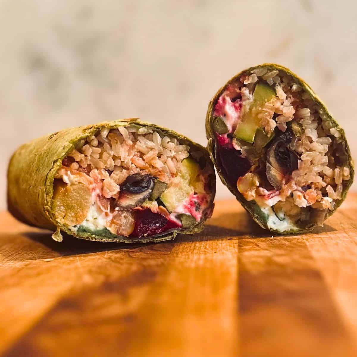 Veggie wrap cut in half.