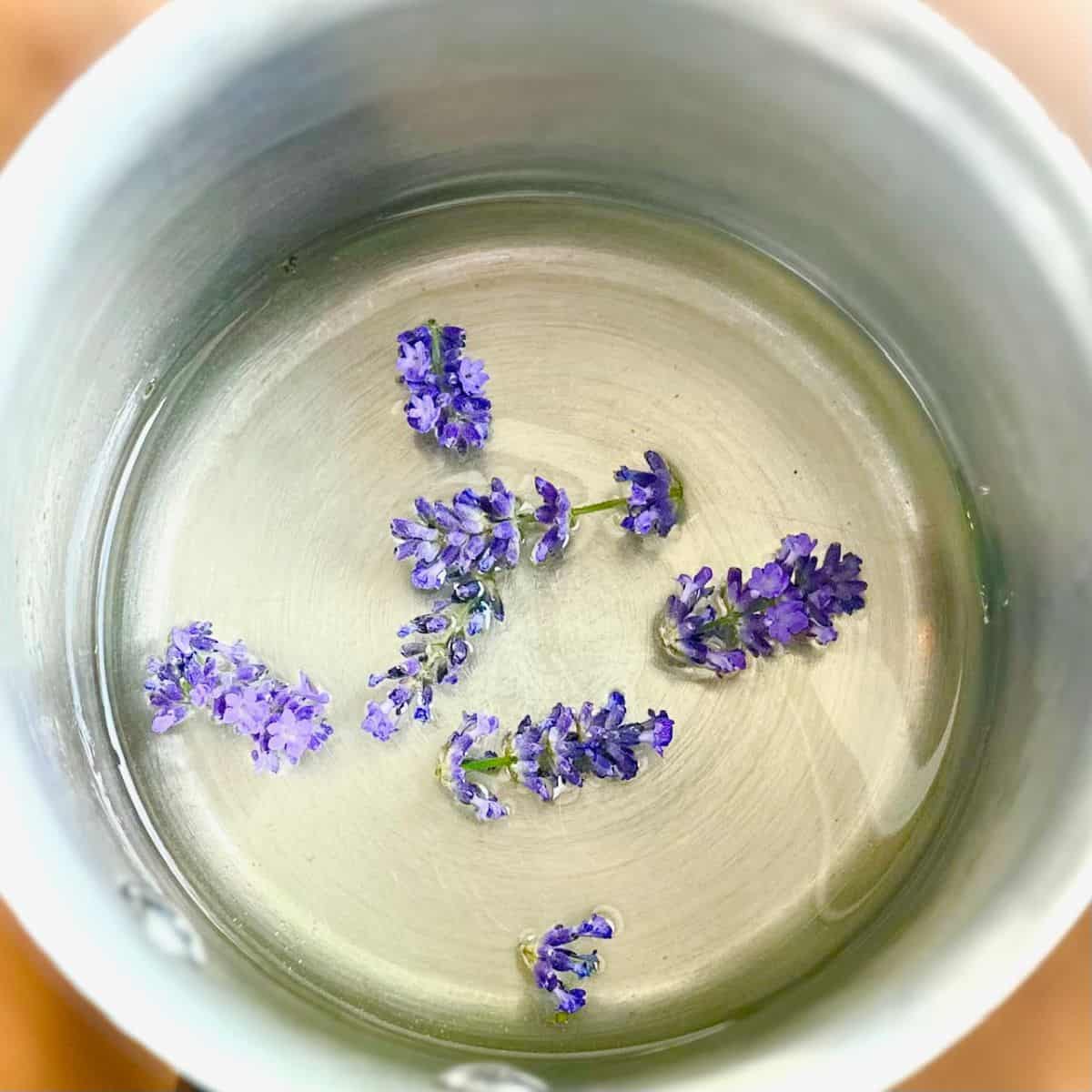 Lavender flowers simmering in a pot.