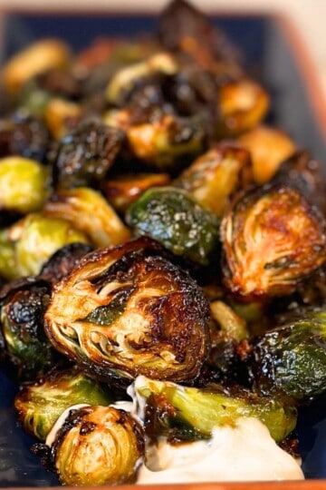 Air fryer Brussel Sprouts on a blue platter.