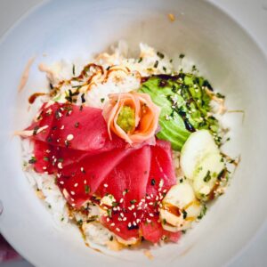 Spicy tuna roll bowl in a white bowl.
