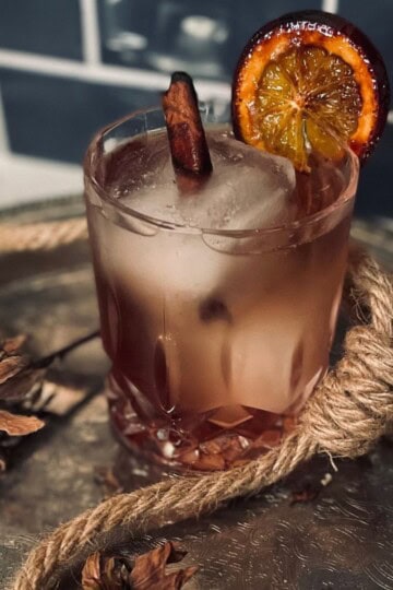 Bourbon cocktail on a silver platter.