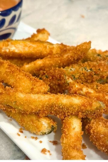 Fried Pickles on a white plate.