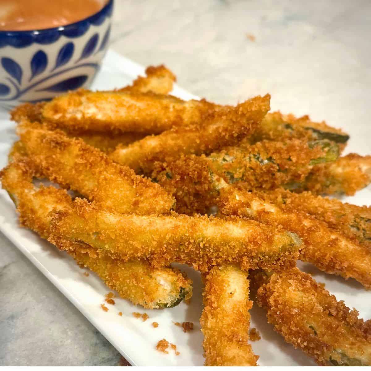 Fried Pickles on a white plate.