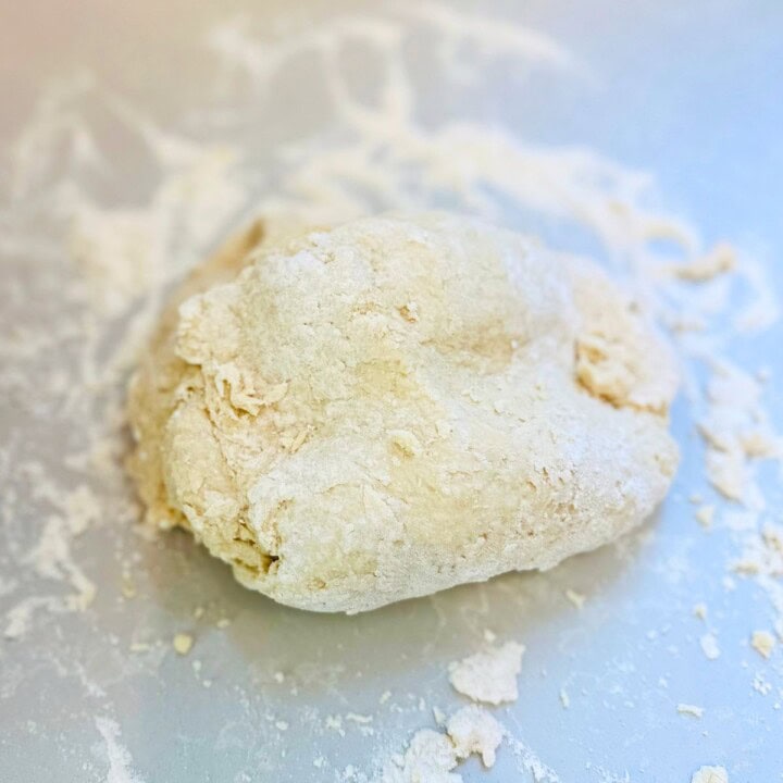 Shaggy ball of cottage cheese bread dough.