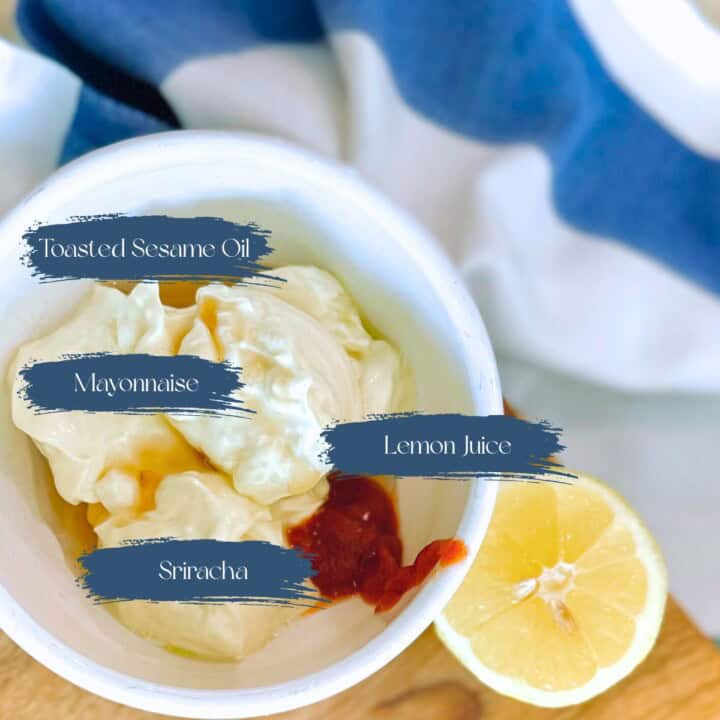 Ingredients for spicy dipping sauce in a white bowl.