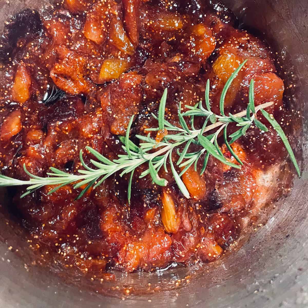 fig jam with a sprig of rosemary.
