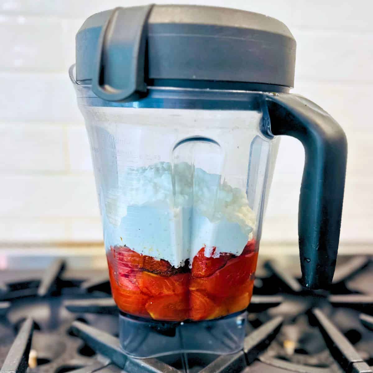 Roasted tomatoes and cottage cheese in a blender.