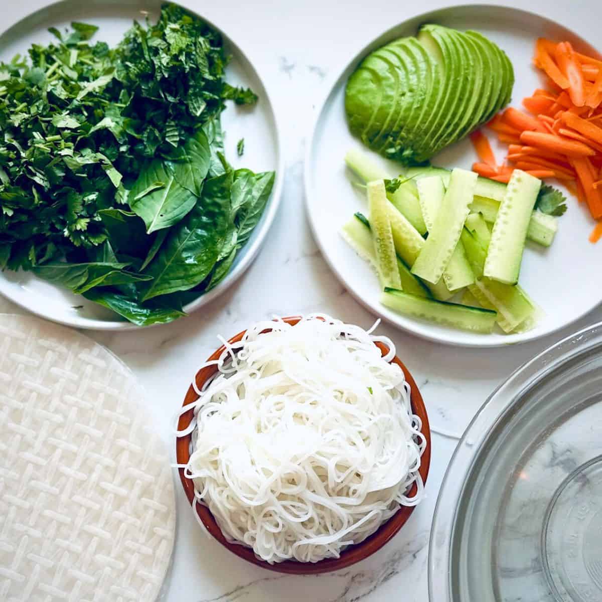 Prepped ingredients for thai fresh rolls.