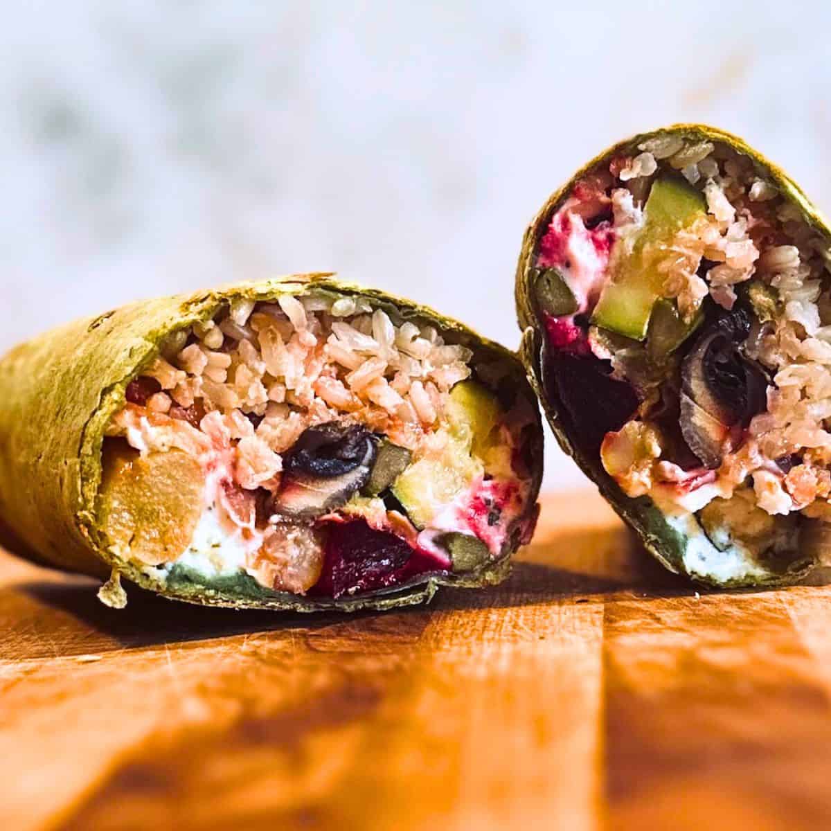 Veggie wrap cut in half.